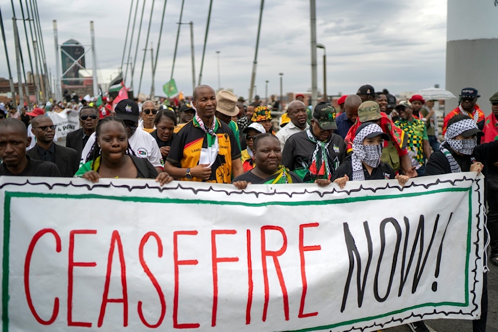 Demonstrators in support of Palestinians march across the Mandela Bridge, in downtown Johannesburg, South Africa, Wednesday, Nov. 29, 2023 (AP Photo/Jerome Delay, File)