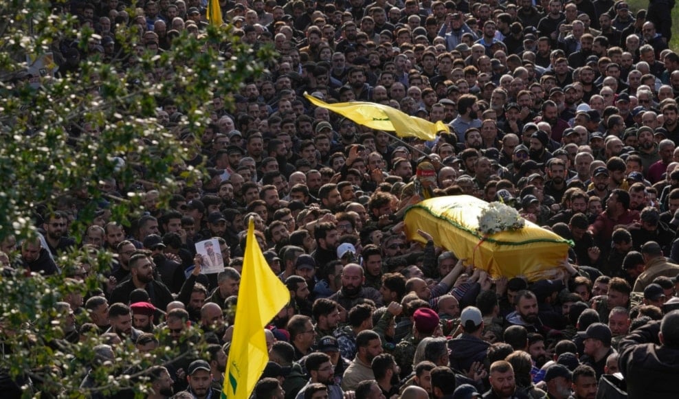 Mourners carry the coffin of senior Hezbollah commander Wissam Tawil, during his funeral procession in the village of Khirbet Selm, south Lebanon, Tuesday, Jan. 9, 2024. (AP)