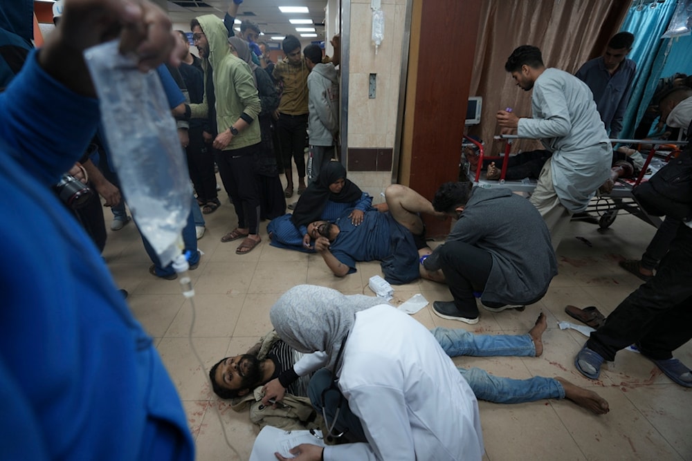 Palestinians wounded in the Israeli bombardment of the Gaza Strip are brought to Al Aqsa hospital in Deir al Balah, Gaza Strip, Sunday, Jan. 7, 2024. (AP)