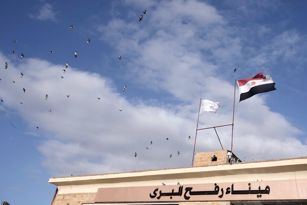 Birds fly over Rafah crossing, Egypt, Monday, Nov. 27, 2023. (AP Photo/Amr Nabil)