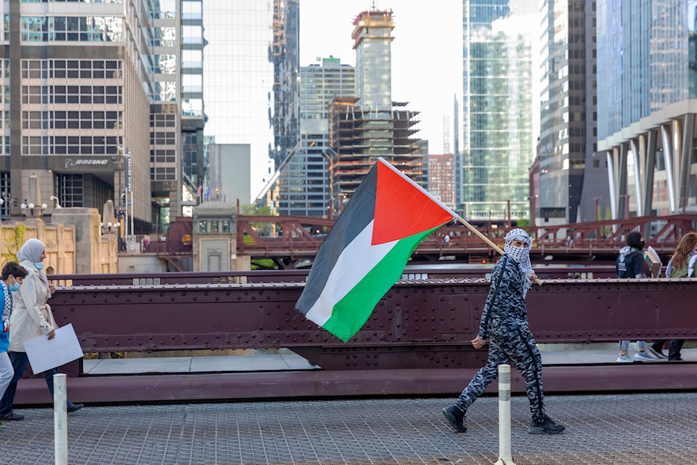 Protesters walk away from Accenture Tower after a rally that was held in solidarity with Palestinians, in Chicago on Wednesday, May 12, 2021. (AP)