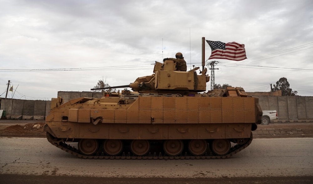 US occupation soldiers patrol in a fighting vehicle in Hassakeh, Syria, Tuesday, Feb. 8, 2022. (AP)