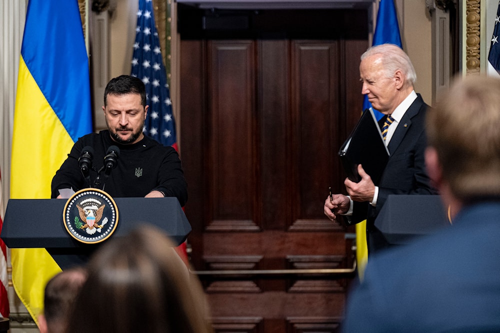 President Joe Biden and Ukrainian President Volodymyr Zelenskyy depart a news conference in the Indian Treaty Room in the Eisenhower Executive Office Building on the White House Campus, Tuesday, Dec. 12, 2023, in Washington. (AP)