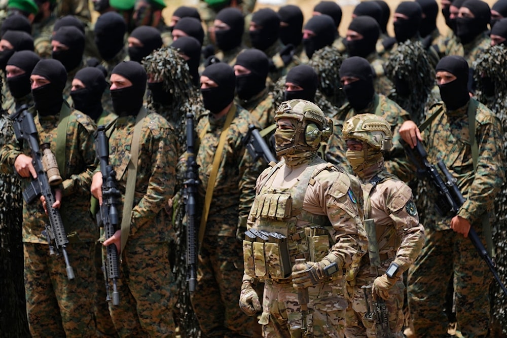 Fighters from the Lebanese resistance group Hezbollah carry out a training exercise in Aaramta village in the Jezzine District, southern Lebanon, Sunday, May 21, 2023 (AP Photo/Hassan Ammar)