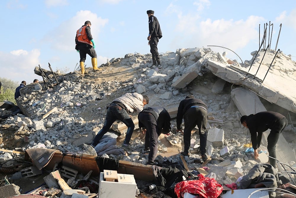 Palestinians search for survivors after an Israeli airstrike on a residential building In Rafah, Gaza Strip, Saturday, Feb. 10, 2024. (AP Photo/Hatem Ali)