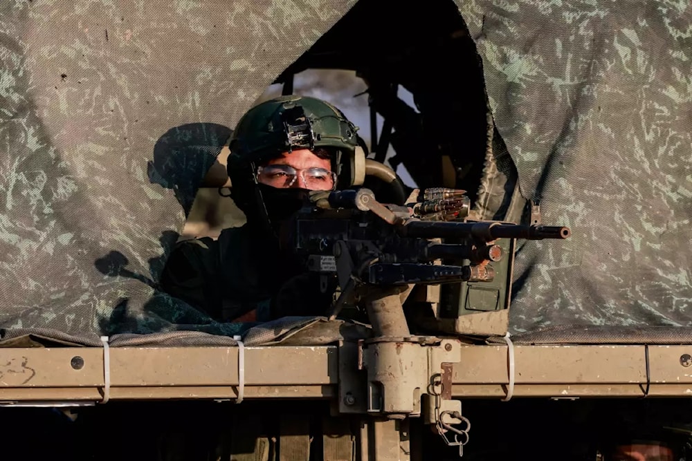 Israeli soldiers move near the Gaza border fence. (AFP/Getty Images)