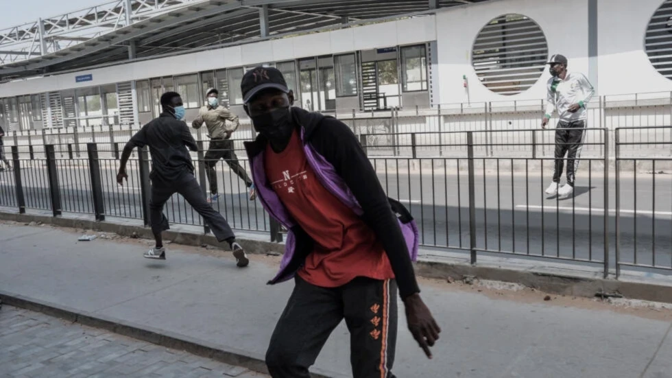 Protestors react during clashes with police in Dakar on February 9, 2024. (AFP)
