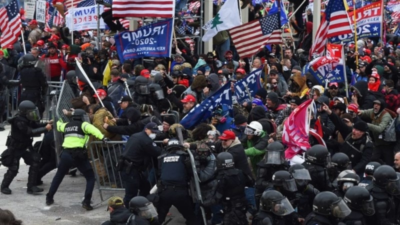 Trump supporters clash with US police and security forces as they push barricades to storm the US capitol, on January 6, 2021. (AFP)