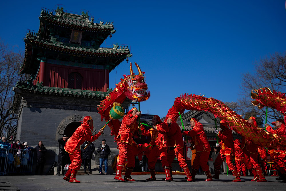 Chinese dragon dancers perform at the Dongyue Temple on the first day of the Chinese Lunar New Year in Beijing, Saturday, Feb. 10, 2024(AP)