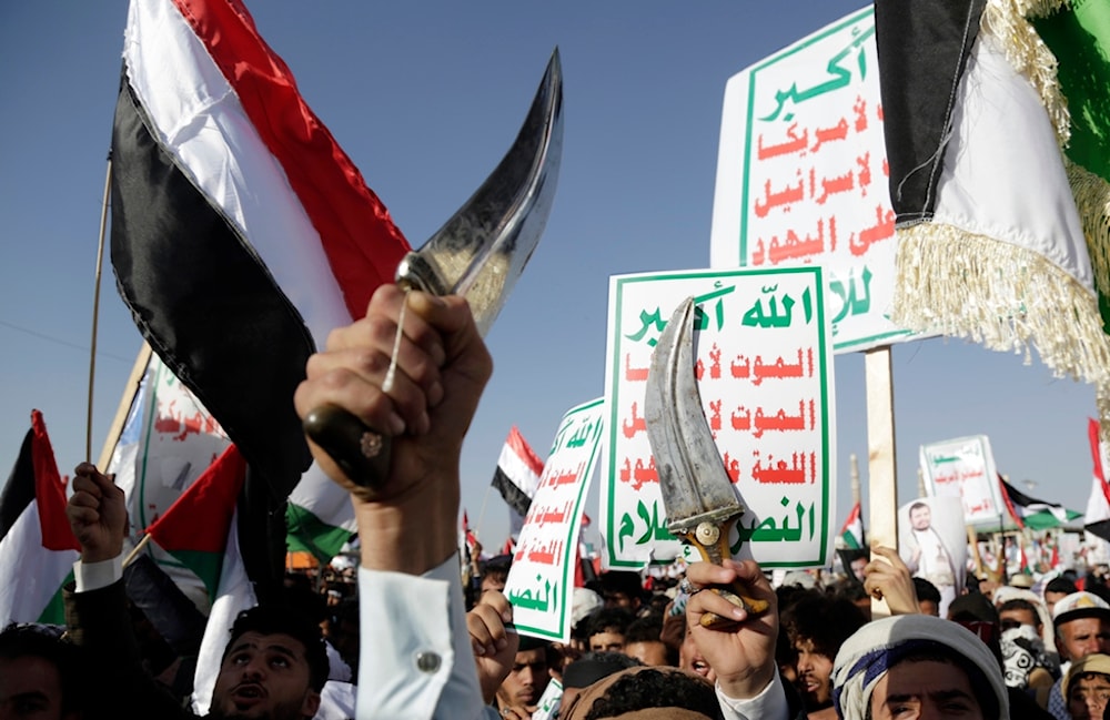 Houthi supporters attend a protest against the United States-led airstrikes on Friday, Jan 12, 2024, in Sanaa, Yemen (AP)