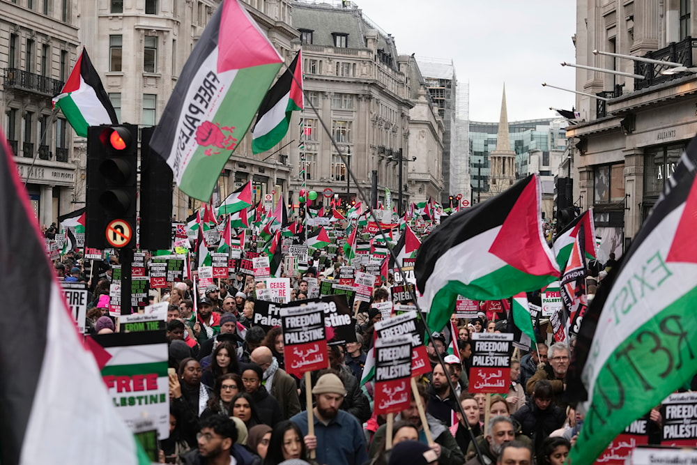 Pro-Palestinian protesters hold up banners, flags, and placards during a demonstration in London, Saturday, Feb. 3, 2024, as they demand a full cease-fire and an end to the siege of Gaza(AP)