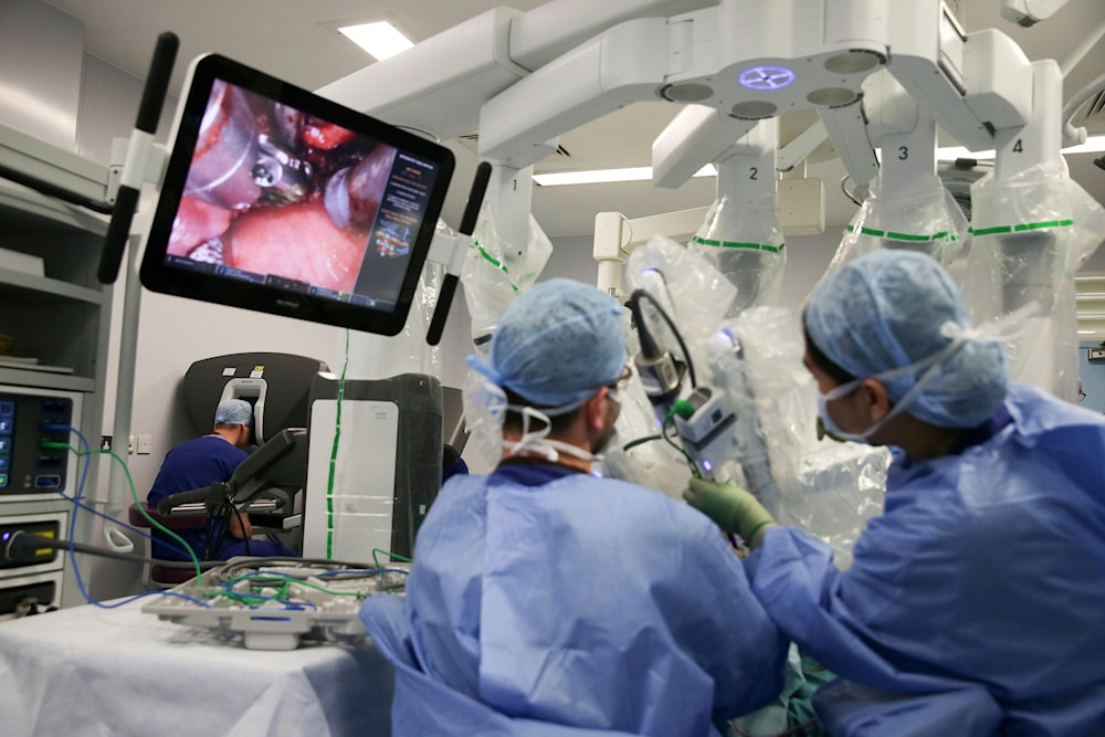 Lead surgeon Vin Paleri conducts a robotic assisted tongue base hemiglossectomy surgery on a patient during his visit to the Royal Marsden NHS Foundation Trust in London, Jan. 10, 2018. (AP)