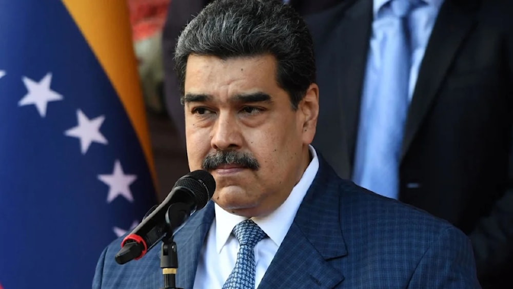 Venezuelan President Nicolas Maduro speaks with the press after holding a meeting with FIFA president Gianni Infantino at the Miraflores Presidential Palace in Caracas, on October 15, 2021. (AFP via Getty Images) 