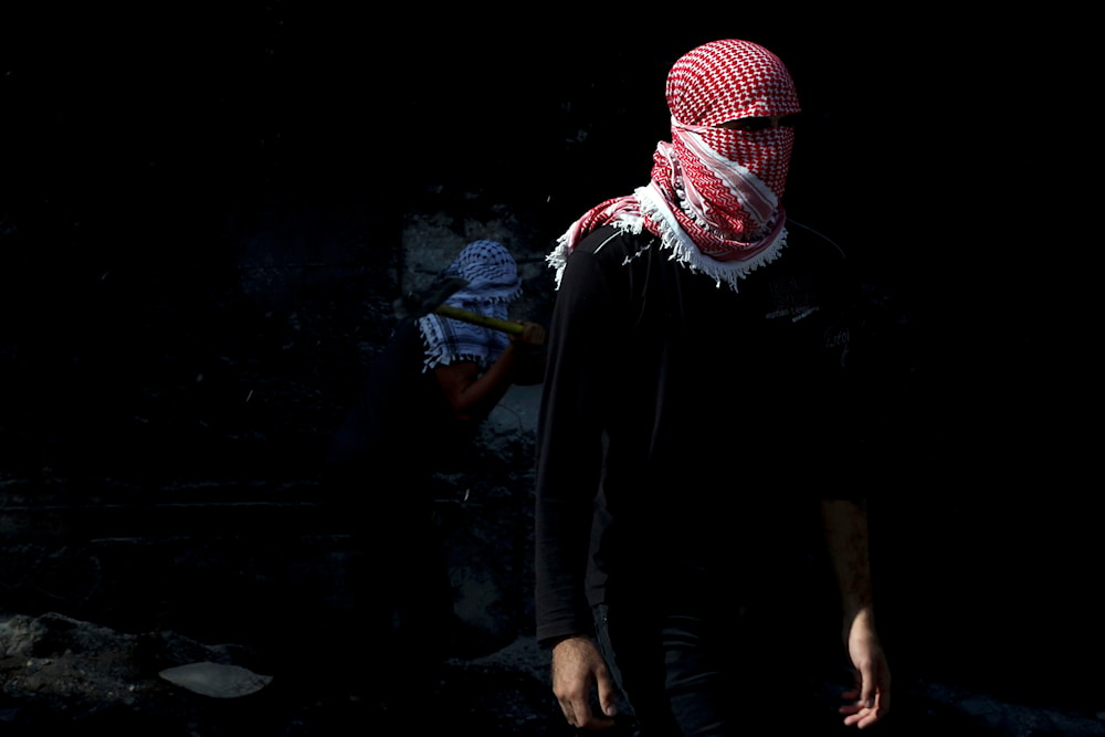 A Palestinian student stands during a protest at the separation barrier between the West Bank and Israel in Abu Dis Monday, Nov. 2, 2015. (AP)