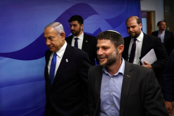 Benyamin Netanyahu and Bezalel Smotrich prior to a meeting at the prime minister's office in occupied Al-Quds on February 23, 2023. (AP)