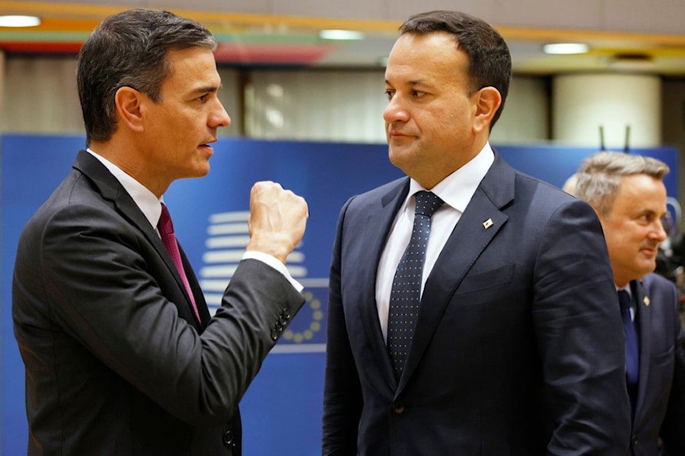 Spain's Prime Minister Pedro Sanchez, left, speaks with Ireland's Prime Minister Leo Varadkar during a round table meeting at an EU summit in Brussels, Thursday, Oct. 26, 2023. (AP)