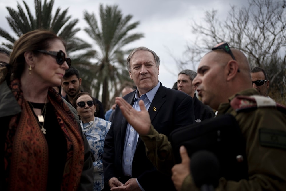 Former U.S. Secretary of State Mike Pompeo, center, and his wife, Susan, left, tour 