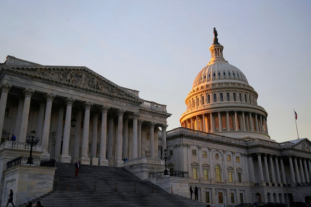 The suns begins to set on the Capitol building  in Washington, Wednesday, Jan. 4, 2023. (AP Photo/Alex Brandon)