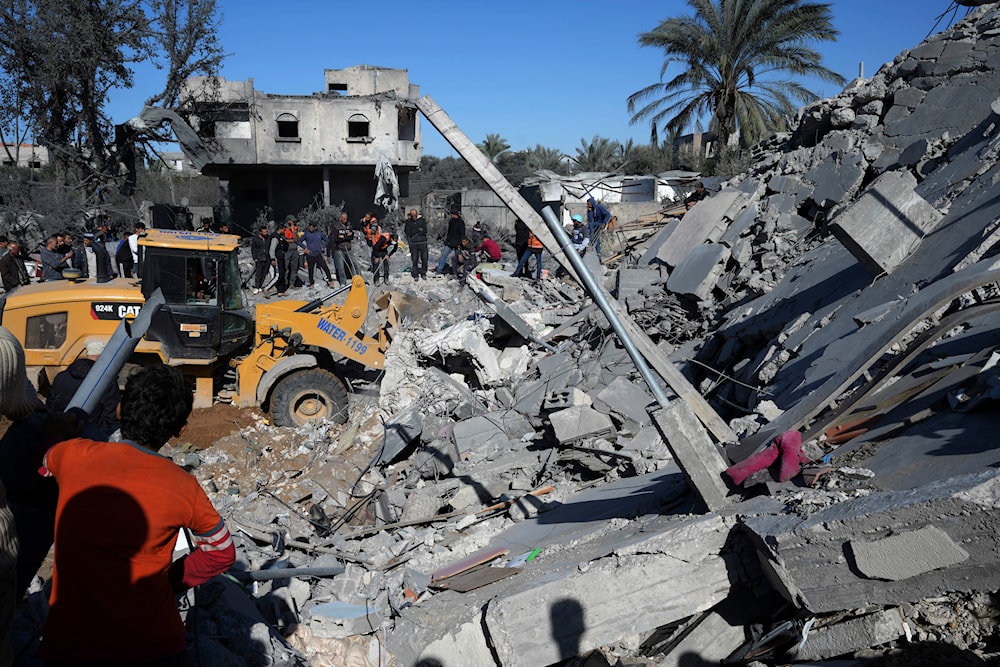 Palestinians search for survivors after an Israeli airstrike on building of Rayan family in Nusseirat refugee camp, central Gaza Strip, Thursday, Feb. 15, 2024(AP)