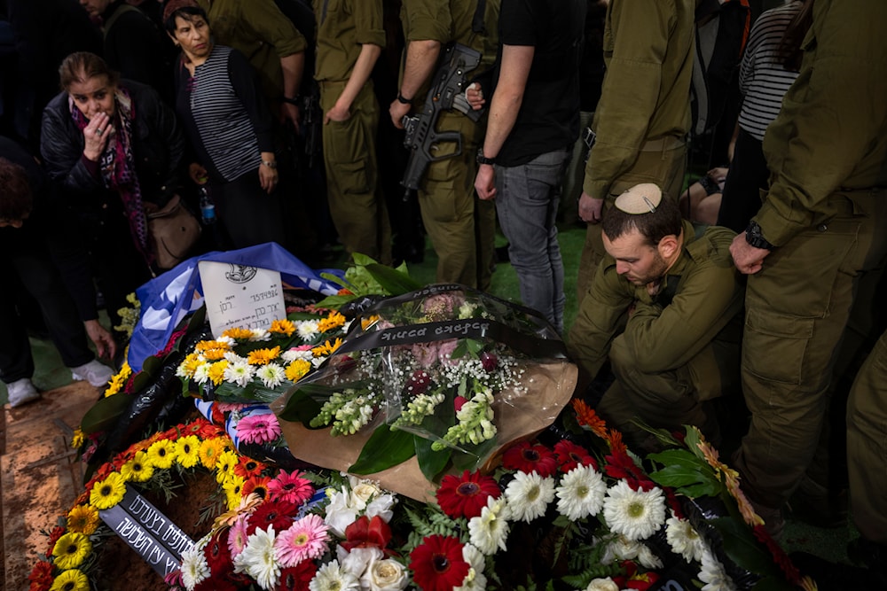 Family and friends of Israeli reservist Yair Cohen gather around his grave during his funeral in 'Tel Aviv', 'Israel', Tuesday, Feb. 13, 2024. (AP)