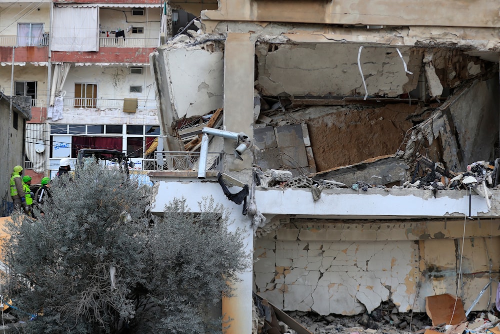Civil defense and rescue workers remove rubbles from a building that was attacked Wednesday night by an Israeli airstrike, in Nabatieh town, south Lebanon, Thursday, Feb. 15, 2024(AP)