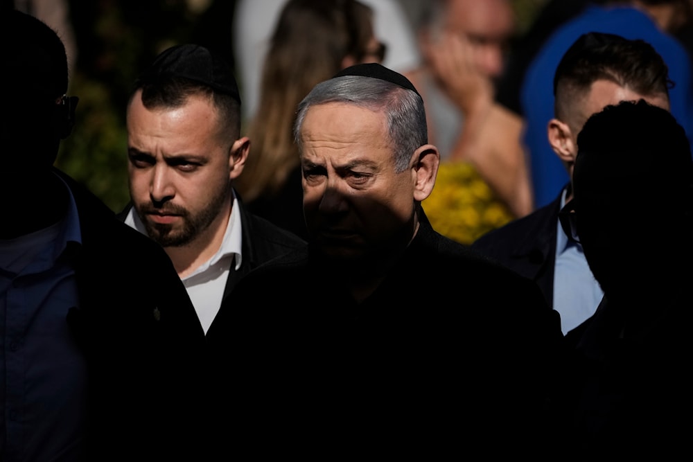Israeli Prime Minister Benjamin Netanyahu at the military cemetery in 'Herzliya', occupied Palestine, December 8, 2023 (AP)