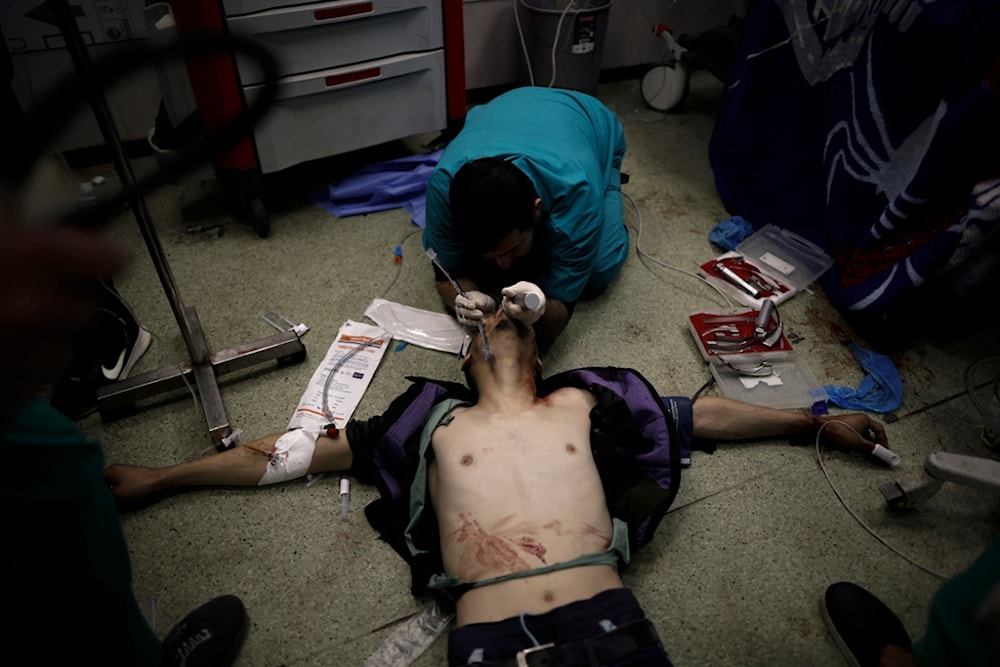 A Palestinian wounded in the Israeli bombardment of the Gaza Strip receives treatment at the Nasser hospital in Khan Younis, Southern Gaza Strip, Monday, Jan. 22, 2024. (AP)
