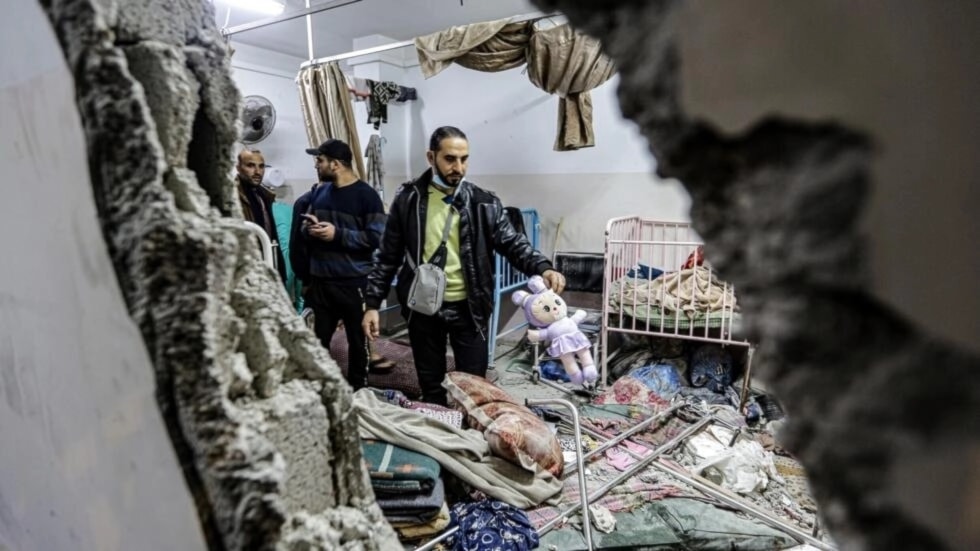 Palestinians inspect the damage following an Israeli bombardment of Nasser Hospital in the main southern Gaza Strip city of Khan Younis on December 17. (AFP)