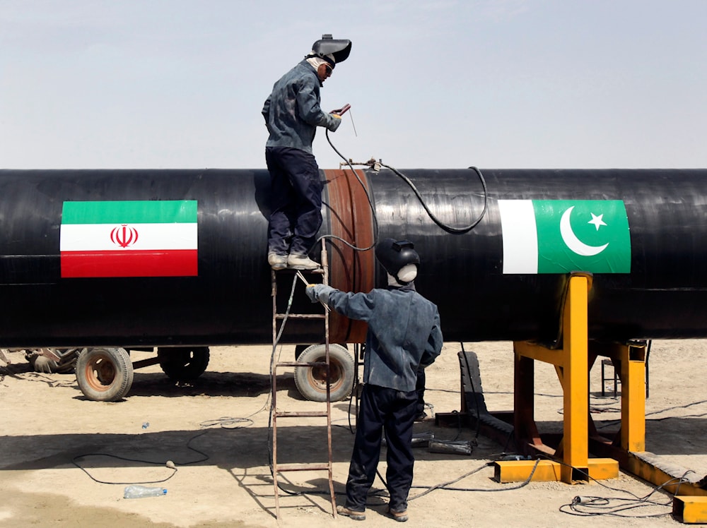 In this March 11, 2013 file photo, Iranian workers weld two gas pipes together at the start of construction on a pipeline to transfer natural gas from Iran to Pakistan, in Chabahar, southeastern Iran, near the Pakistani border. (AP)