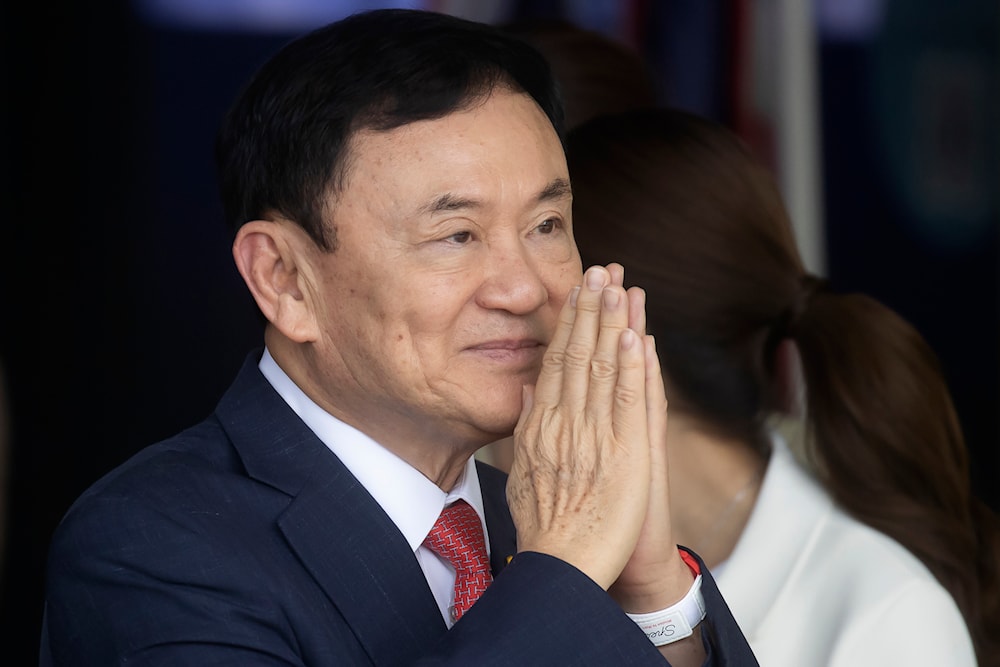 Thailand's former Prime Minister Thaksin Shinawatra greets supporters on his arrival at Don Muang airport in Bangkok, Thailand, on Aug. 22, 2023. (AP)