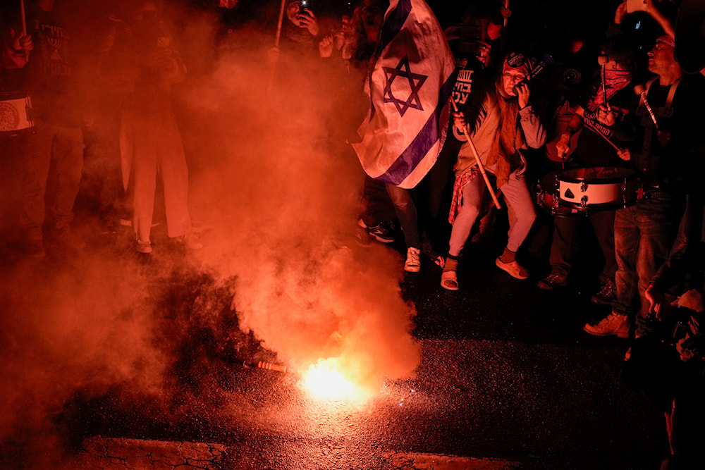 Demonstrators protest against Israeli Prime Minister Benjamin Netanyahu and call for new elections in the latest weekly protest against his handling of the war on Gaza, in 'Tel Aviv', occupied Palestine, Feb. 17, 2024 (AP)