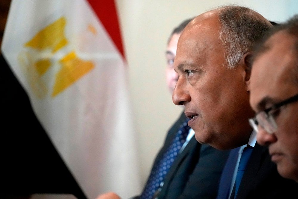 Egypt's Foreign Minister Sameh Shoukry, centre, speaks with his Cypriot counterpart Constantinos Kombos, during their meeting, at the foreign house in Nicosia, Cyprus, on Thursday, Feb. 8, 2024. (AP)