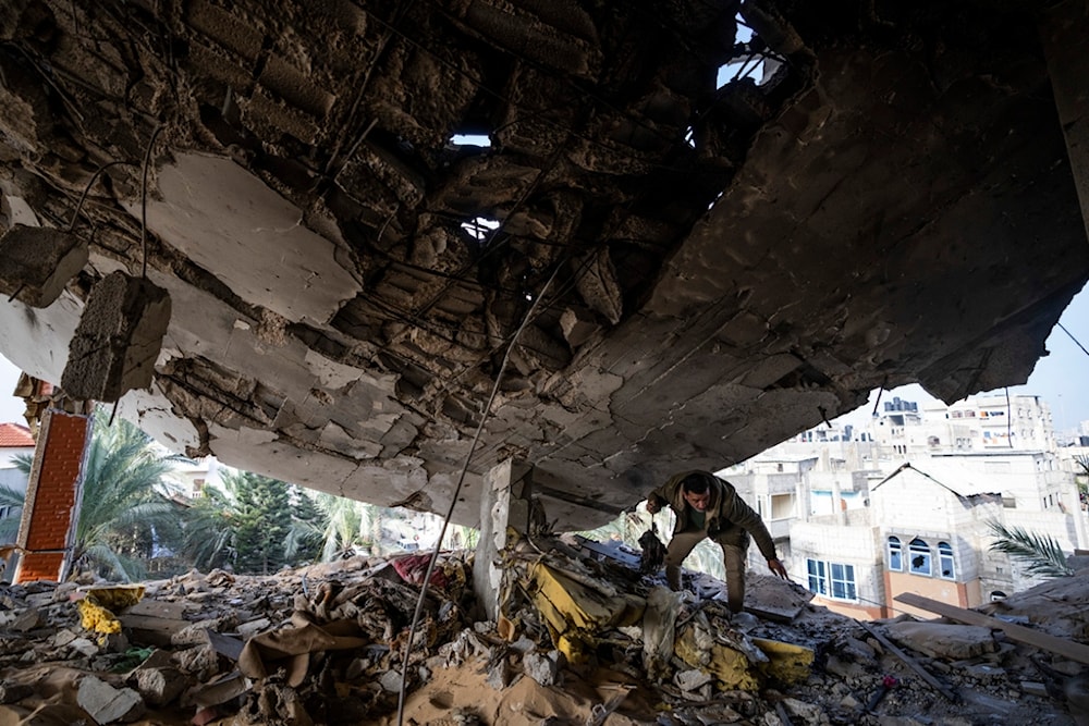 A Palestinian salvages belongings after an Israeli strike in Rafah, Gaza Strip, Saturday, Feb. 10, 2024. (AP)