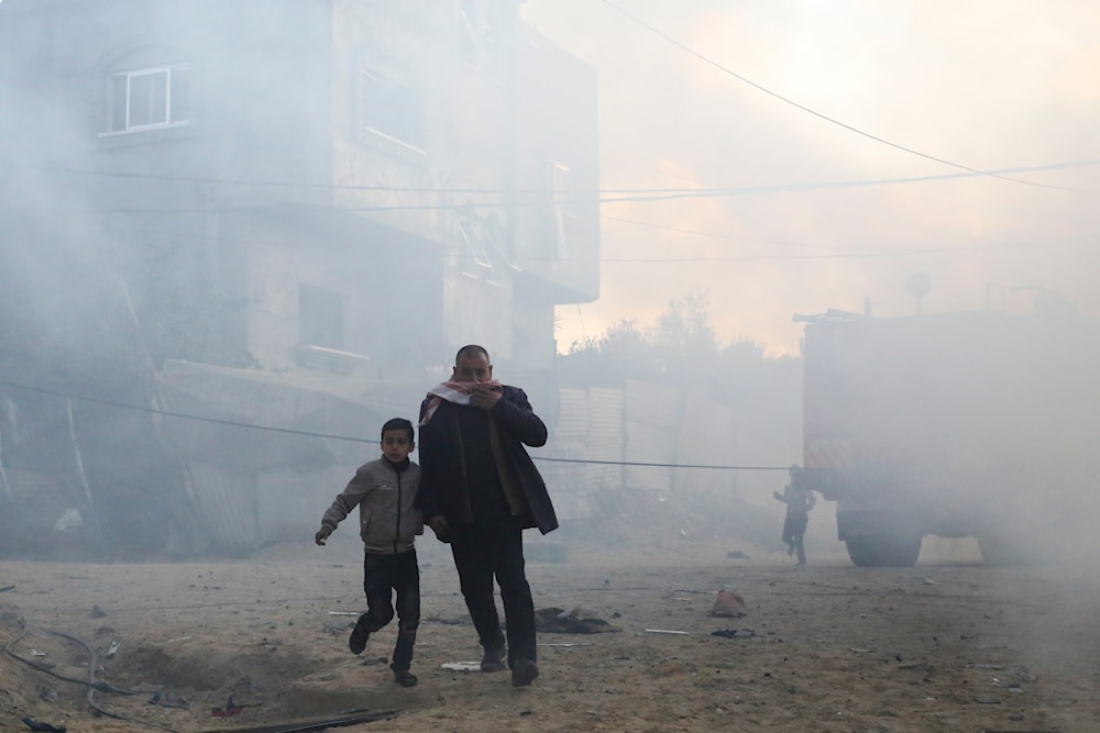 Palestinians run away after an Israeli strike on a residential building in Rafah, Monday, Feb. 19, 2024. (AP)