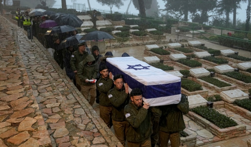 Israeli occupation soldiers carry the flag-draped casket of a dead Israeli occupation soldier during his funeral in occupied al-Quds, Tuesday, Jan. 23, 2024. (AP)