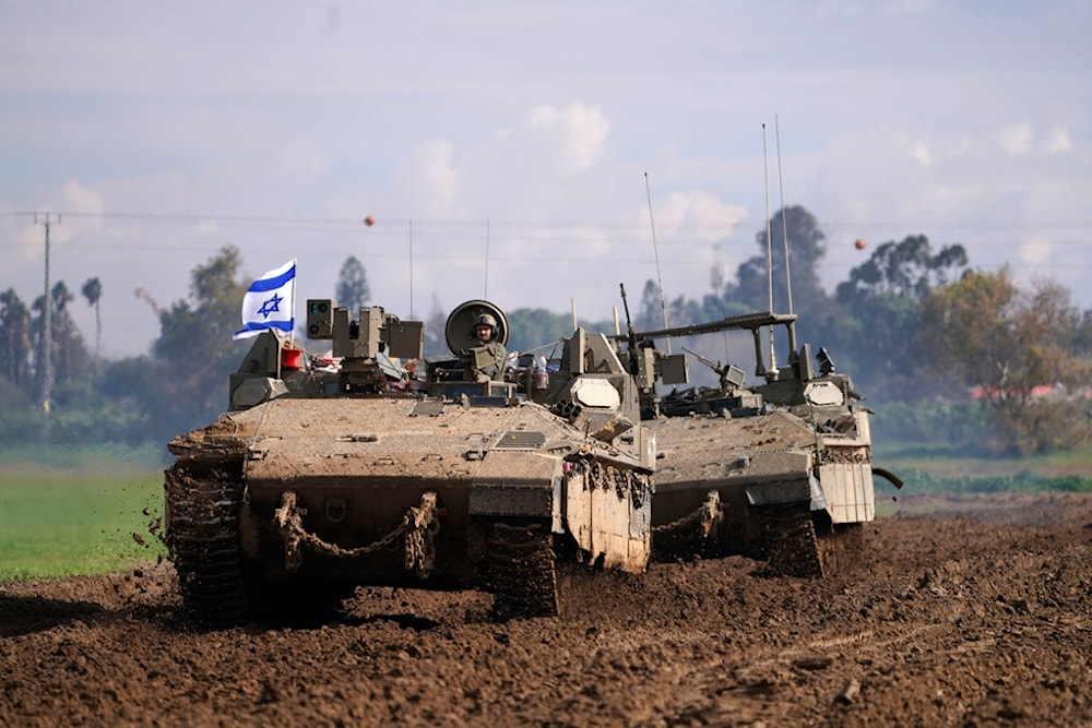 Israeli soldiers drive in their armored vehicles in the southern occupied territories near the border with the Gaza Strip during ongoing ground invasion, Friday, Feb. 2, 2024. (AP)