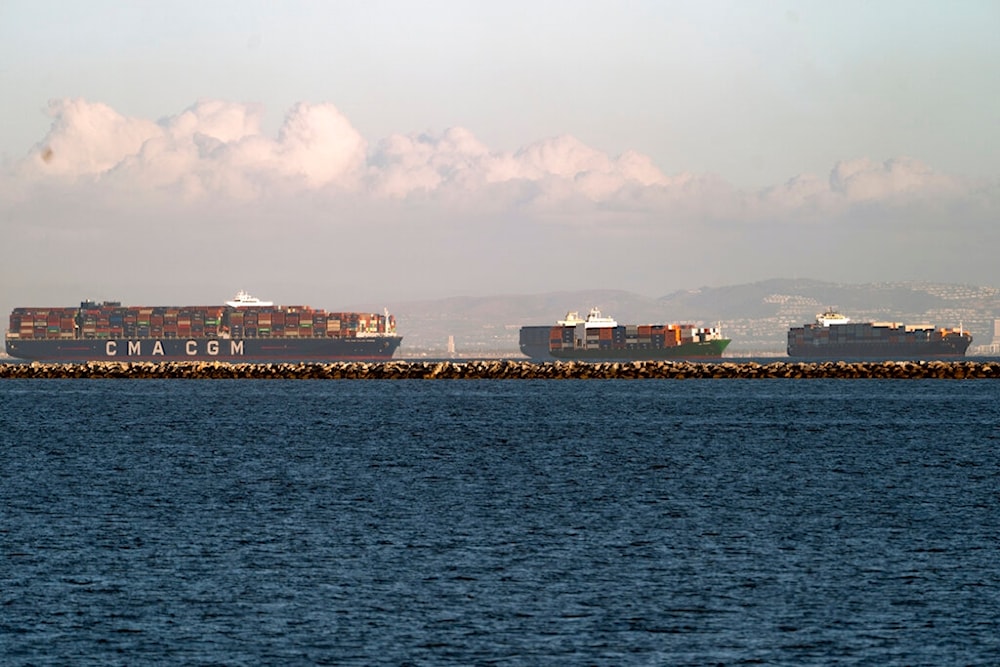 In this Monday, Oct. 18, 2021, photo the container ship CMA CGM Jules Verne, left, and other vessels are seen in queues from the Port of Los Angeles. (AP)