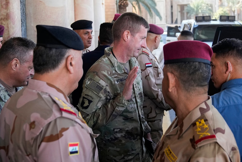 Major General Joel Vowell, center, leaves after the first round of the negotiations between Iraq and the United States to end the International Coalition mission in Baghdad, Iraq, January 27, 2024 (AP) 