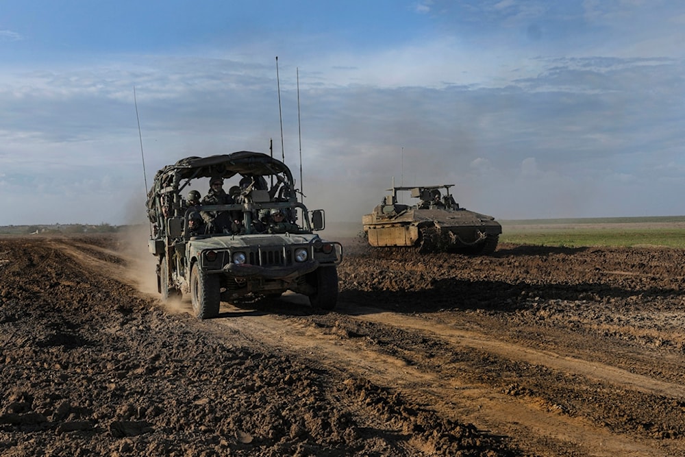 Israeli forces withdraw from Gaza, as they drive in southern occupied Palestine, near the Gaza border, Thursday, Feb. 1, 2024. (AP)