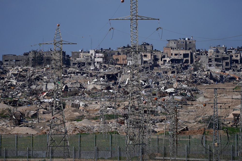 Rubble from buildings destroyed by the IOF ground operation in the Gaza Strip is seen from southern occupied Palestine near the Gaza border fence, Thursday, Feb. 1, 2024. (AP)