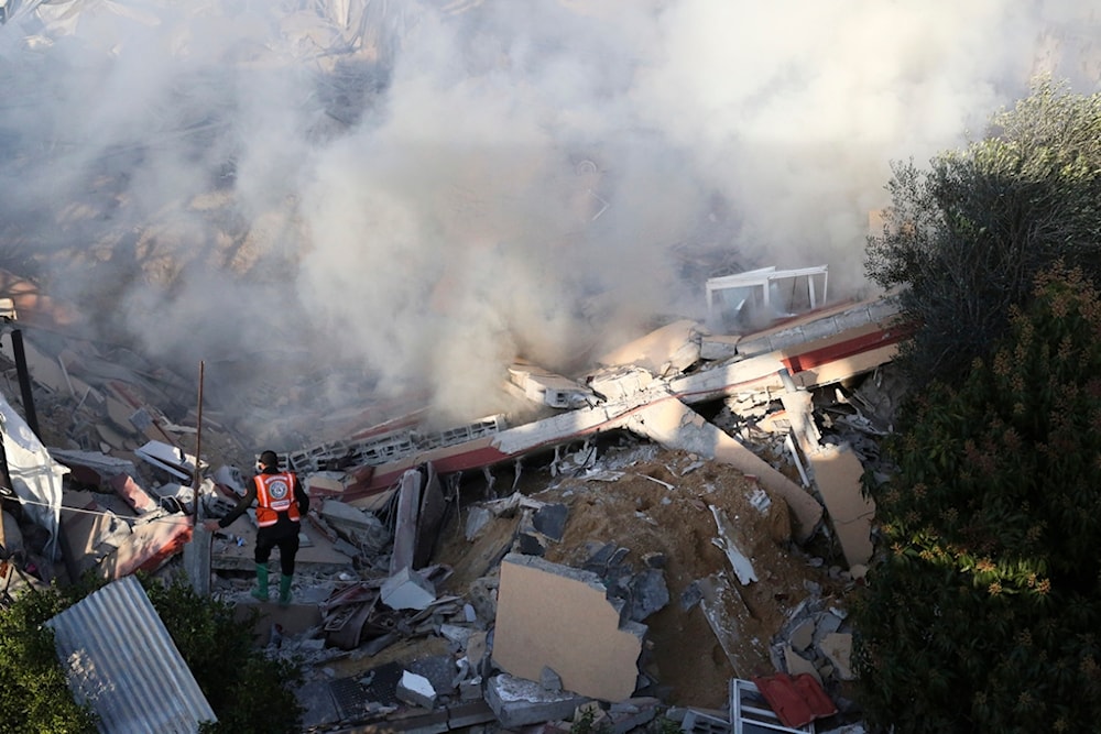 Palestinian emergency services look for survivors after an Israeli strike on a residential building in Rafah, Monday, Feb. 19, 2024. (AP Photo/Hatem Ali)