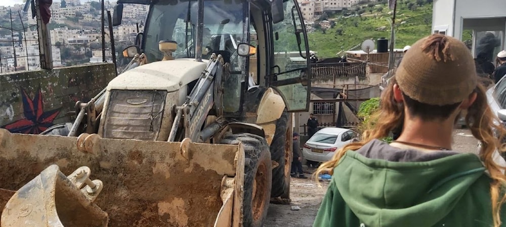 Protected by Israeli occupation forces, settlers seize land in the Batn al-Hawa neighborhood in Silwan, south of Al-Aqsa Mosque on February 20, 2024. (Social media)