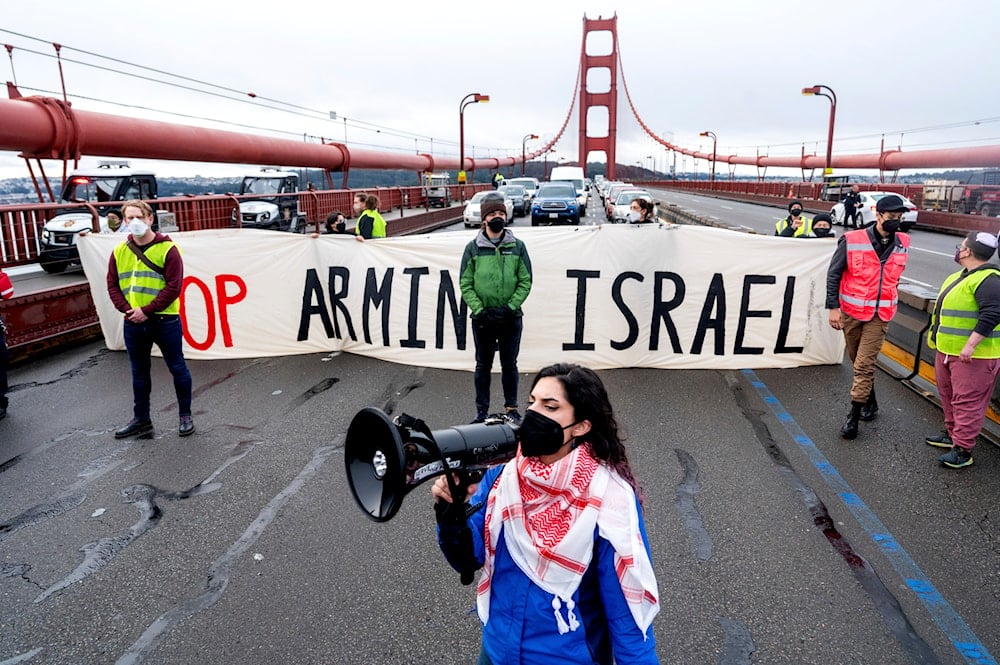 Aysha Abraibesh leads a chant while as pro-Palestinian demonstrators block commute traffic on the Golden Gate Bridge on Wednesday, Feb. 14, 2024, in San Francisco.(AP)