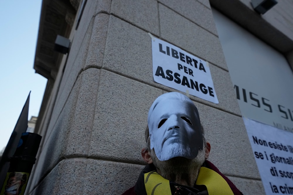 Pro-Assange activists demonstrate outside of the British Consulate in Milan, northern Italy, Tuesday, Feb. 20, 2024. (AP)