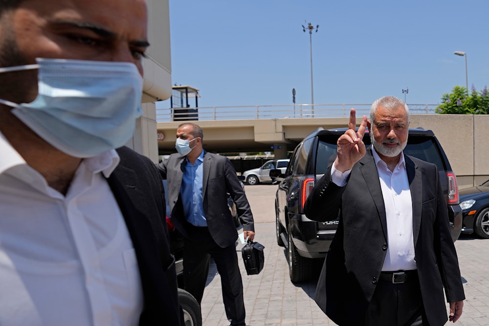 Ismail Haniyeh, head of Hamas's political bureau, flashes the victory sign upon his arrival at Rafik Hariri International Airport, in Beirut, Lebanon, Sunday, June 27, 2021(AP)