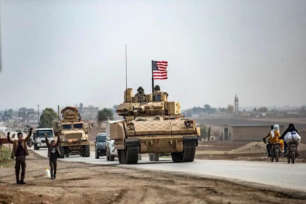 US troops patrol in their military vehicles near the Syrian border on December 17, 2020. (AFP)