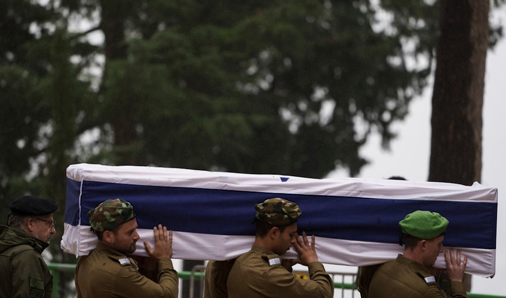 Israeli soldiers carry the flag-draped casket of reservist Sgt. first class Nicholas Berger during his funeral at Mt. Herzl military cemetery in Jerusalem, Israel, Wednesday, Jan. 24, 2024. (AP)