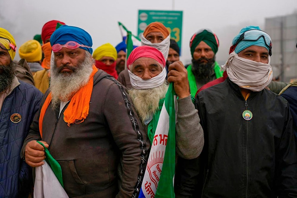 Indian farmers who have been protesting for a week to demand guaranteed crop prices wait to march to the capital near Shambhu border that divides northern Punjab and Haryana states, India, Wednesday, Feb.21, 2024.(AP)