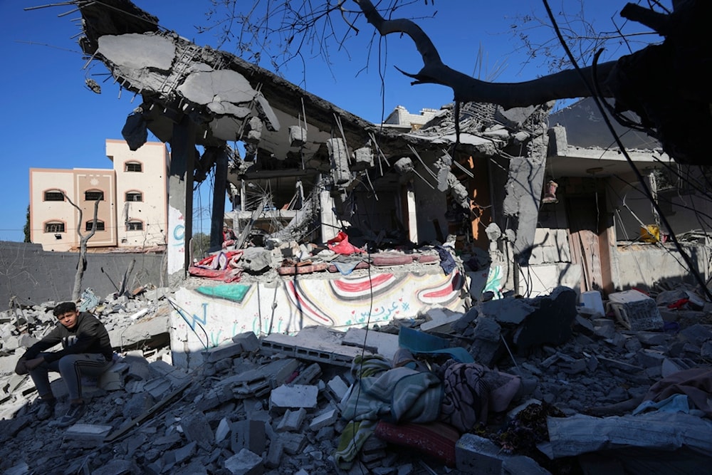 Palestinians inspect the rubble of the Al Daalese family building after an Israeli airstrike in Nusseirat refugee camp, central Gaza Strip, Thursday, Feb. 22, 2024 (AP Photo/Adel Hana)