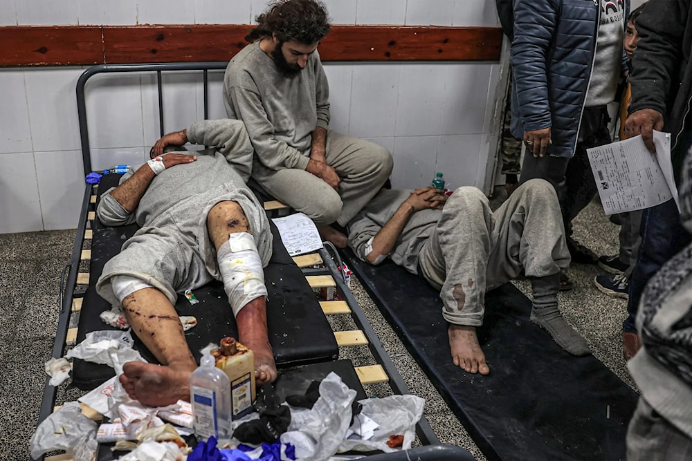 Former Palestinian detainees receiving treatment at a hospital in Rafah, in southern Gaza, after the Israeli military released them. (AFP via Getty Images)